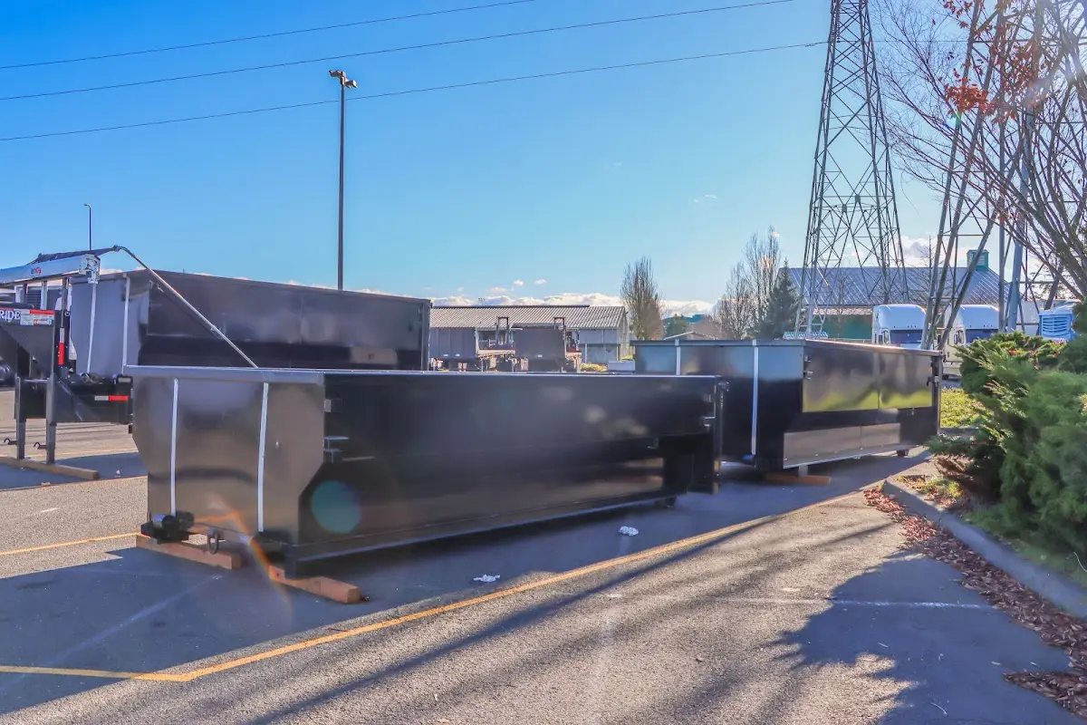 Roll-off dumpster ready for waste disposal at job site for Construction Dumpster Rental in Demopolis